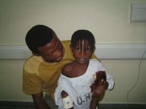 Plamedi with her new teddy bear she named Isha.